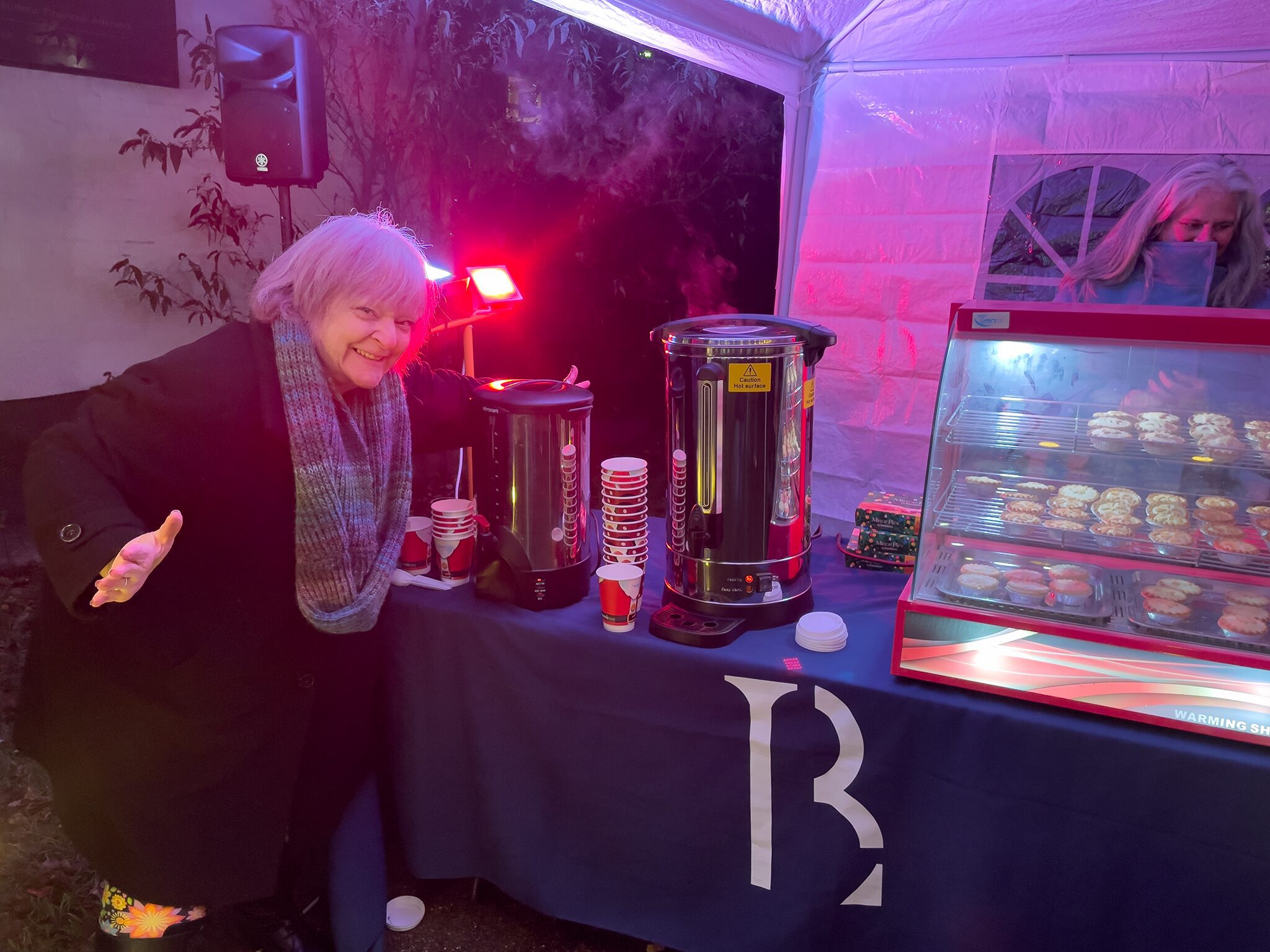 Pam with the hot chocolate and mulled wine at the Midhurst Christmas Street Party